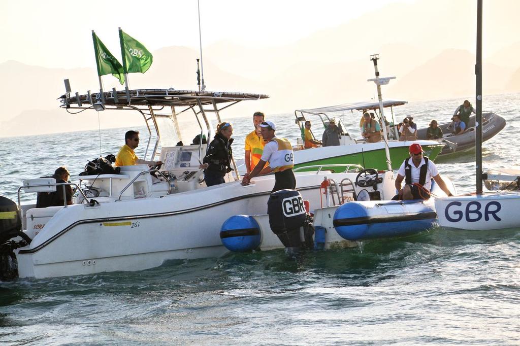 Day 7 - Finn August 14, 2016. Gilles Scott (GBR) being interviewed on the Atlantic Ocean by the BBC after his win in the Finn class. © Richard Gladwell www.photosport.co.nz